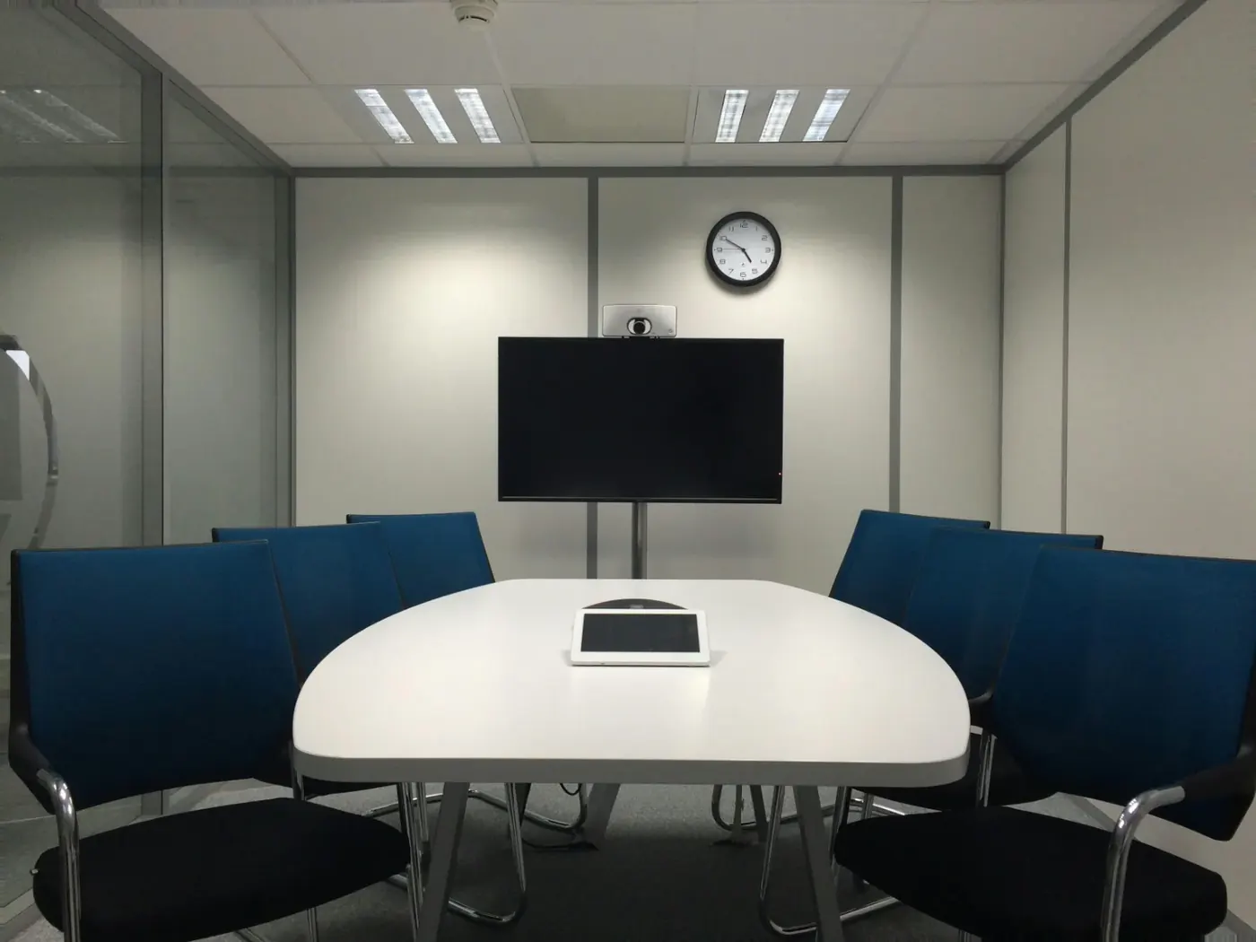 Empty meeting room with a large screen