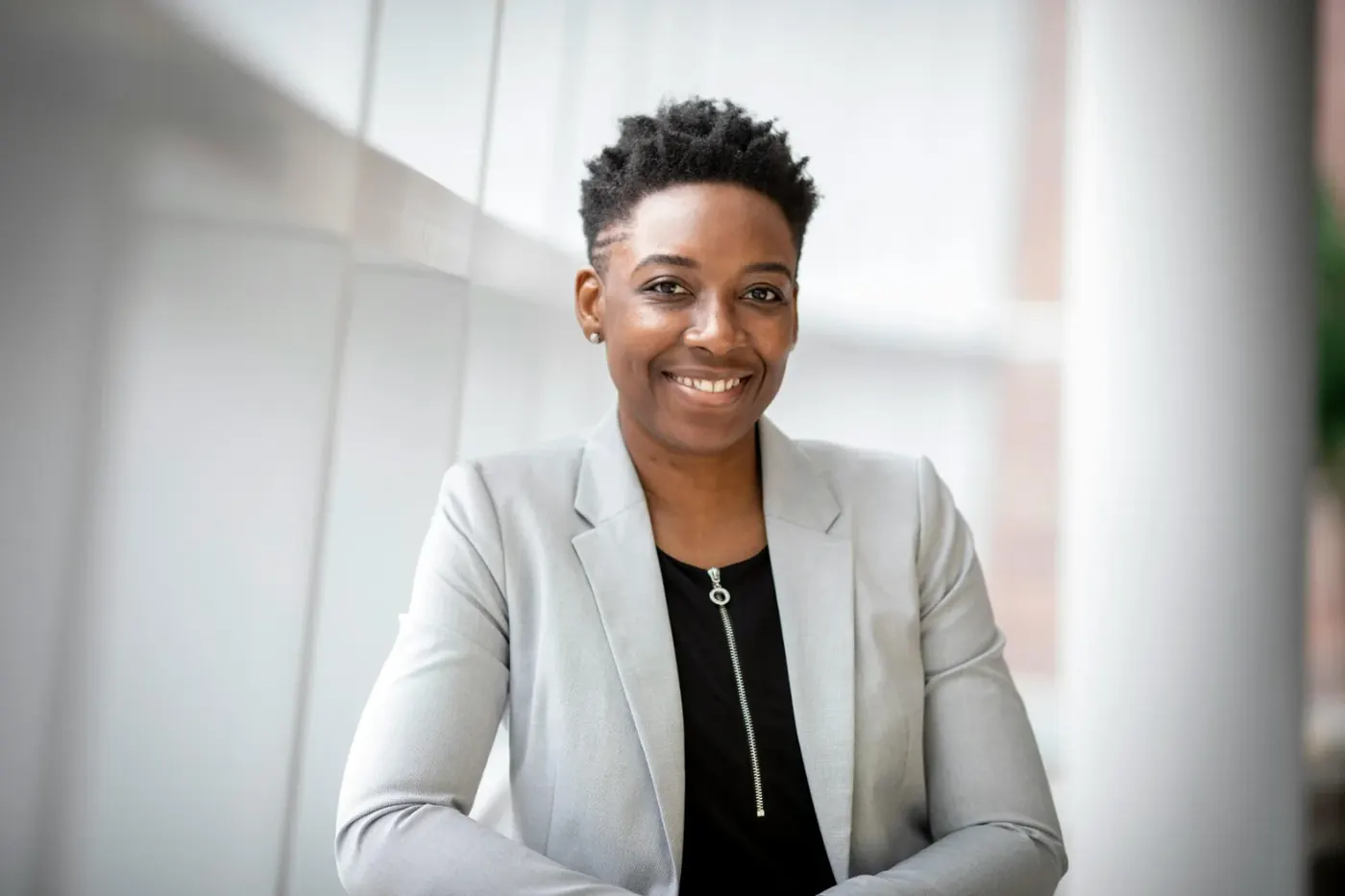 Smiling professional in a light blazer